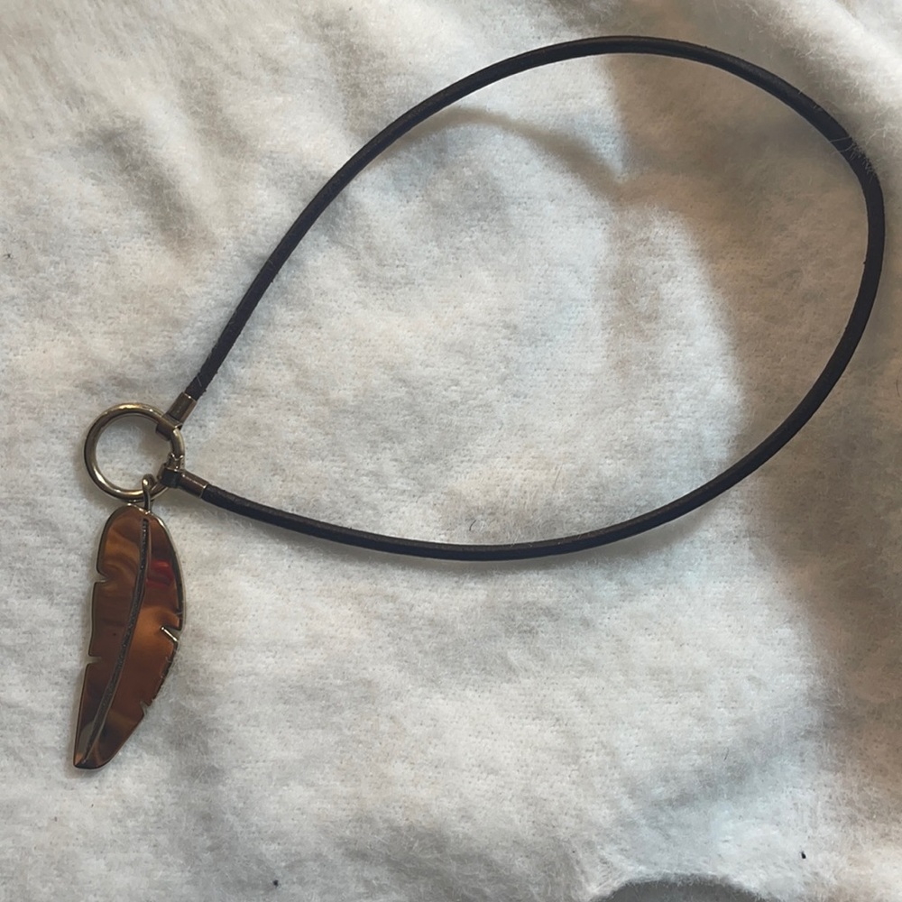 Authentic tous pendant and leather necklace